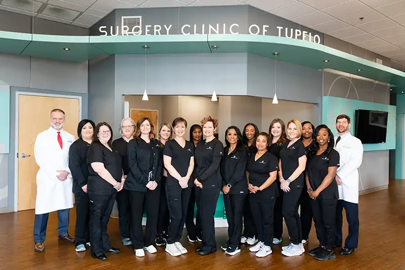 Dr. Terry Pinson and Dr. Will Cauthen stand with the entire Surgery Clinic of Tupelo team at their surgery clinic in Tupelo, MS.